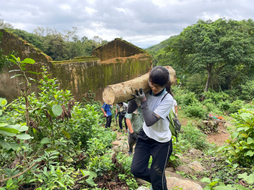 Volunteers participate in repairing handcrafted trail 